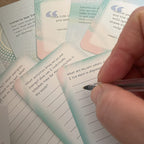Finding My Purpose Journal Cards – close-up of hand journaling in response to a core values reflection prompt, surrounded by advice and quote cards.