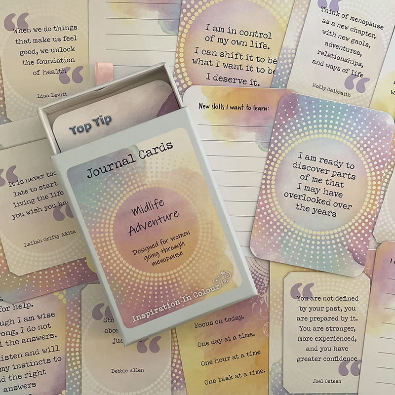 A set of journaling cards featuring inspirational quotes and prompts, including a 'Wildlife Adventure' card, arranged in a flat-lay composition.