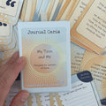 My Teen and Me Journal Cards – deck for parents of teens, boxed set held in hand with guiding question and affirmation cards visible in the background.